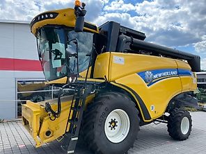 New Holland CX 5.80 inkl. 6,10m Varifeed & Wagen
