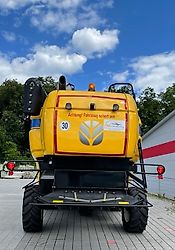 New Holland CX 5.80 inkl. 6,10m Varifeed & Wagen