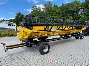 New Holland CX 5.80 inkl. 6,10m Varifeed & Wagen